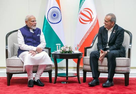 PM Modi holding hands Pezeshkian