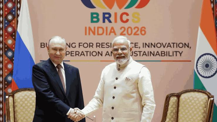 PM Modi holding hands Pezeshkian