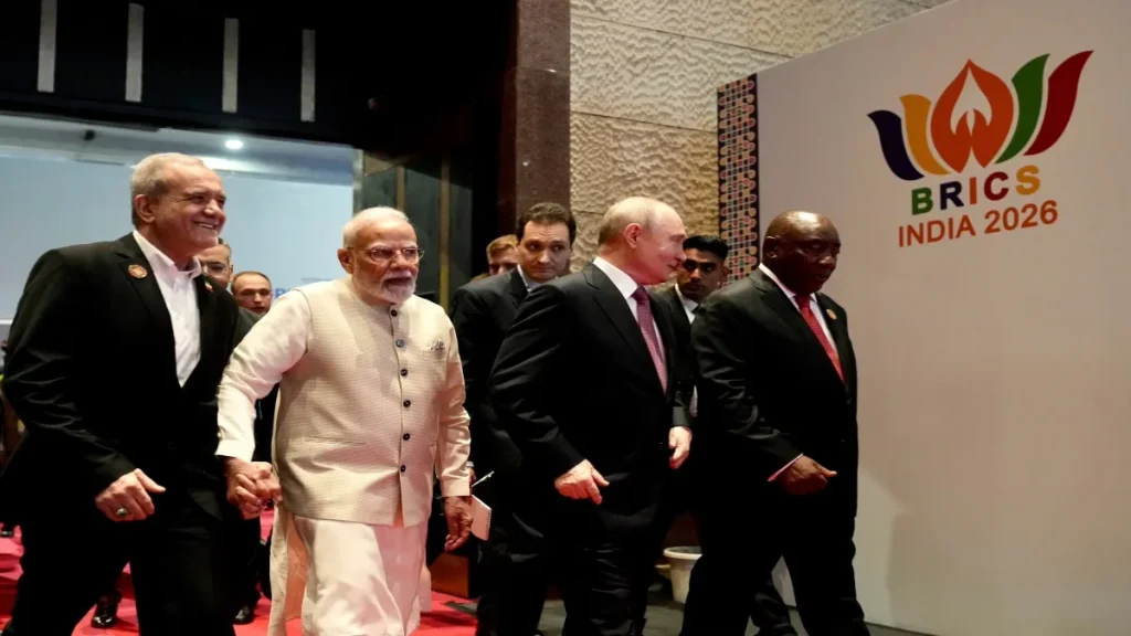 PM Modi holding hands Pezeshkian